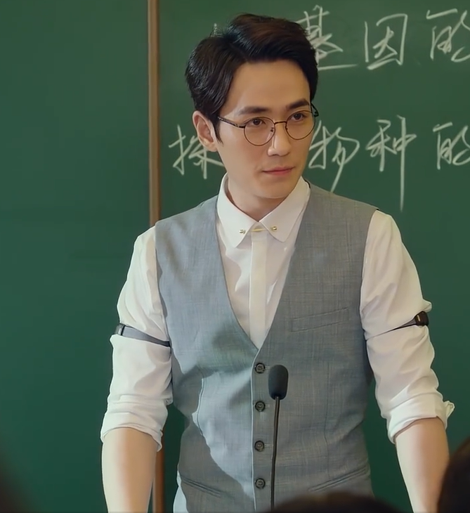 A man standing in front of a chalkboard