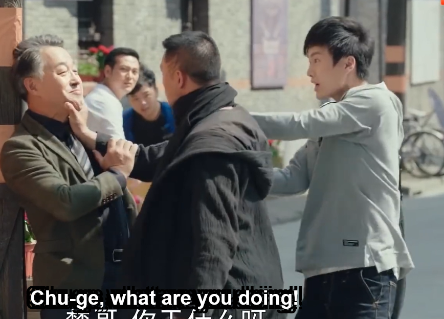 Guo Changcheng grabs Chu Shuzhi's arm and tries to pull him away from the Regent.