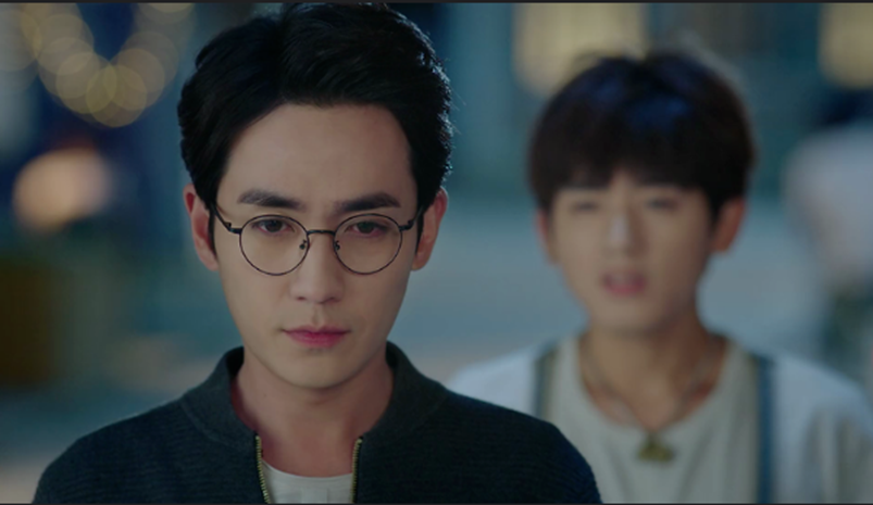 Da Qing stands behind Shen Wei as he talks.